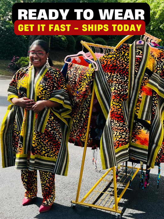 Woman wearing a two-piece African print ensemble featuring a cotton Ankara kimono jacket with Aso Oke accents and matching elastic waist pants, standing outdoors.